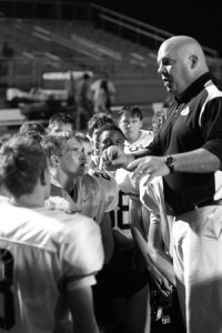 Coach Barnett Coach Barnett talks to his players after a game.