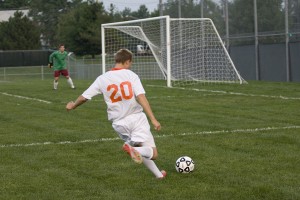 Senior Sam Mccrillis launches a shot from just outside the 18 box. Mccrillis had two goals in the Cougars victory. Senior Sam Mccrillis launches a shot from just outside the 18 box. Mccrillis had two goals in the Cougars victory.