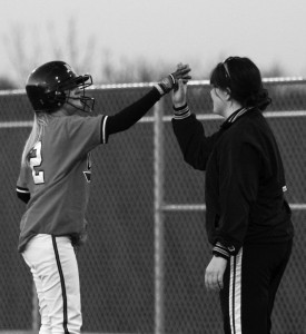 Kincaid coaching Coach Lindsay Kincaid gives player Loryn Goebel a highfive.
